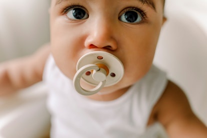 a cute baby in an article about baby won't take pacifier