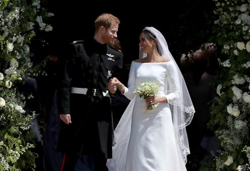 WINDSOR, UNITED KINGDOM - MAY 19:  Prince Harry, Duke of Sussex and The Duchess of Sussex share a ki...