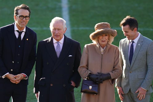 King Charles III and the Queen Consort during their visit to Wrexham Association Football Club's Rac...
