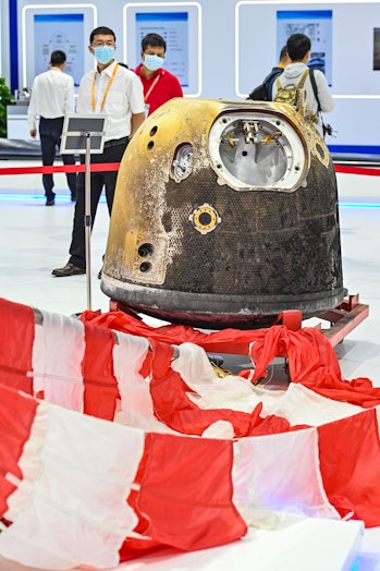 ZHUHAI, CHINA - SEPTEMBER 30: The return capsule and parachute of the Chang'e-5 probe are on display...