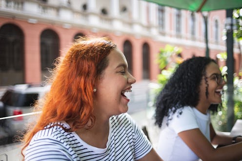 Young friends at a cafe outdoors