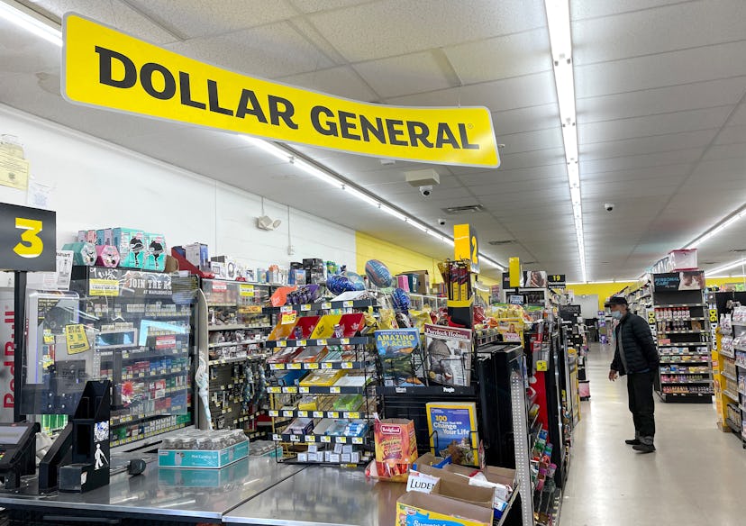 A customer shops at a Dollar General store. Dollar General's 2022 Christmas hours favor late shoppin...
