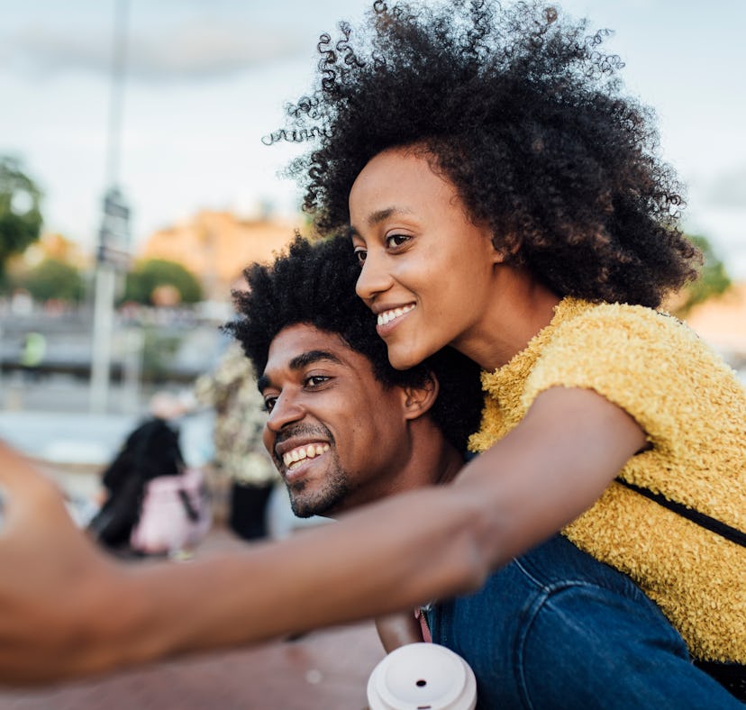 A couple films a seflie video to add to their 2022 recap TikTok for the year.