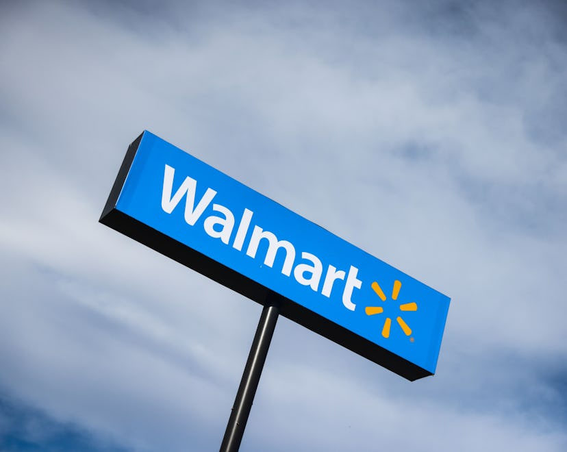 A Walmart store sign, in an article about Walmart New Year's store hours.