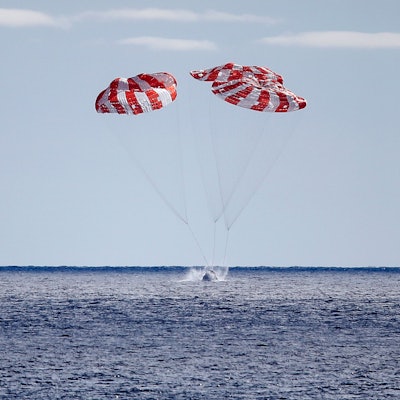 AT SEA, PACIFIC OCEAN - DECEMBER 11: NASA's Orion Capsule splashes down after a successful uncrewed ...