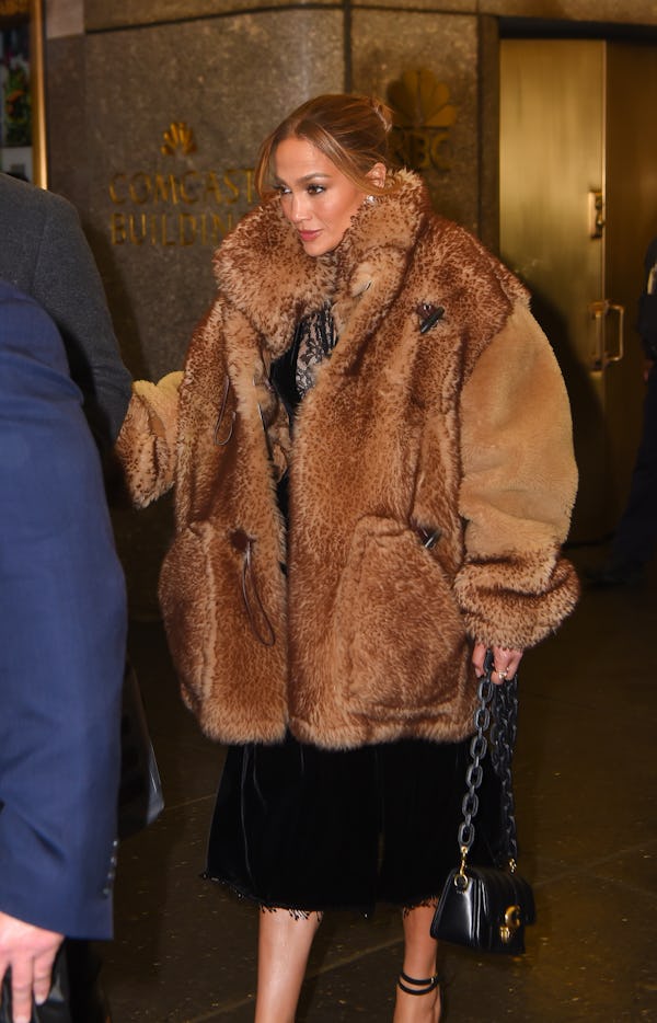 Jennifer Lopez wearing a fuzzy shearling coat from Coach.