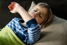 Sick little boy covering his mouth while coughing, how to stop persistent cough in children
