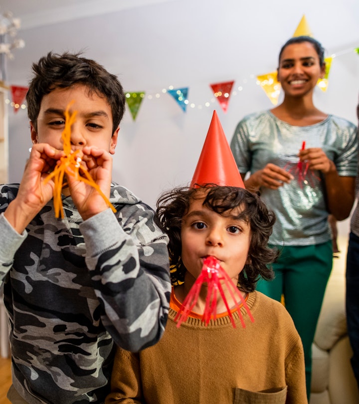 New Year's Eve party celebration with kids, a mixed-age, multi-ethnic family 