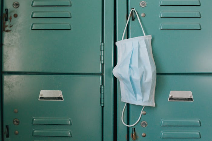 Face mask hanging inside gym on locker. Gym re-openings were a controversial part of the Coronavirus...