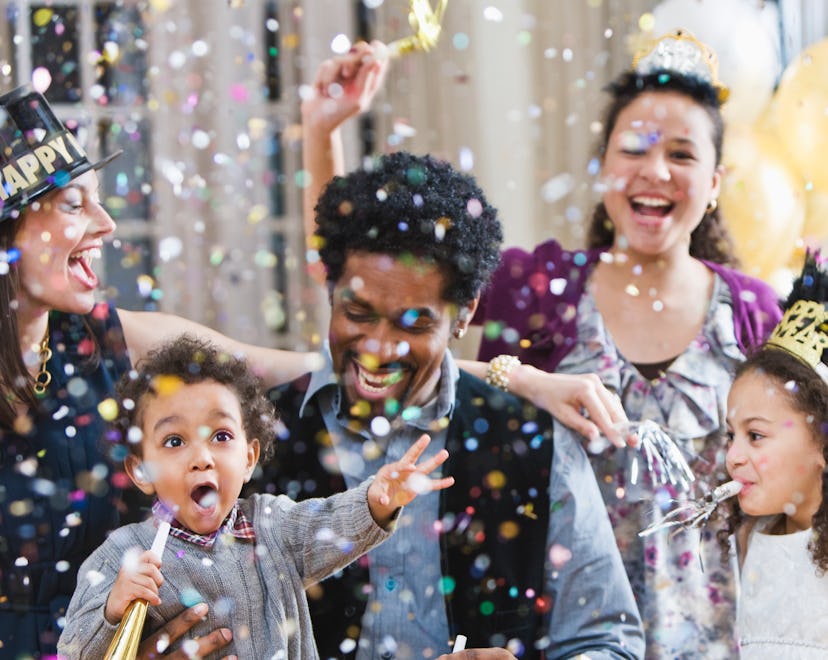 family enjoying and celebrating the New Year with these new year's eve traditions
