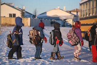 Kids waiting for the school bus in January