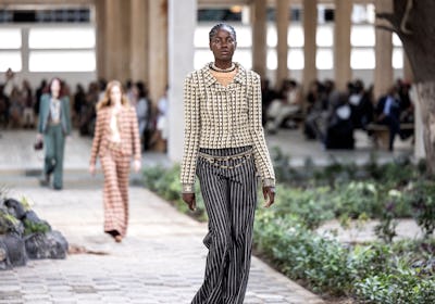 A model walks down the catwalk during the luxury brand Chanels fashion show, Metiers dart, in Dakar ...