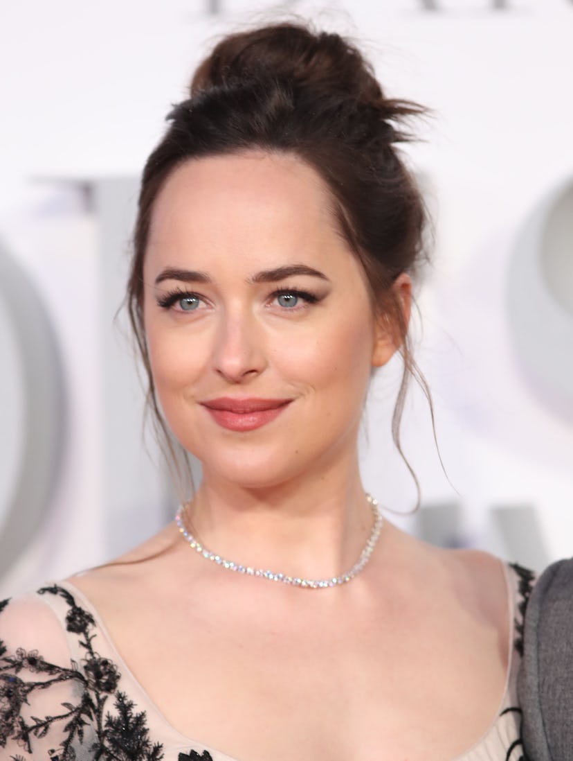Dakota Johnson without bangs, forehead visible, with a romantic bun at the "Fifty Shades Darker" UK ...