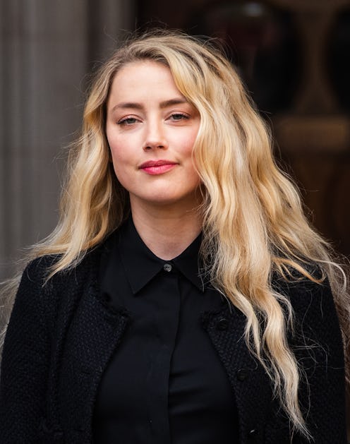 LONDON, ENGLAND - JULY 28: Amber Heard reads a statement after the trial at  the Royal Courts of Jus...