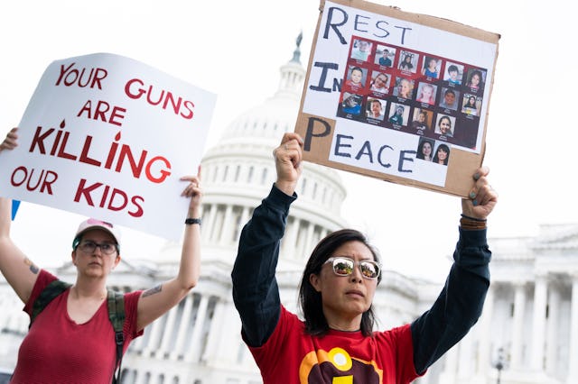 UNITED STATES - MAY 26: A demonstrator holds a sign depicting children killed at the Robb Elementary...