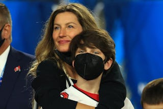 Gisele Bundchen says she's "recharging" in Brazil. Here, she celebrates with stepson John Moynahan a...