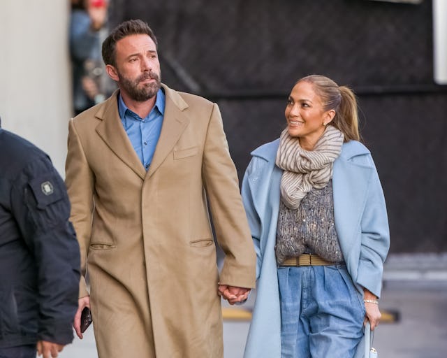Ben Affleck and Jennifer Lopez performed a song together at their Christmas party. Here, they are se...