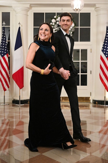 US actress Julia Louis-Dreyfus (L) and her son Charles Hall arrive at the White House to attend a st...