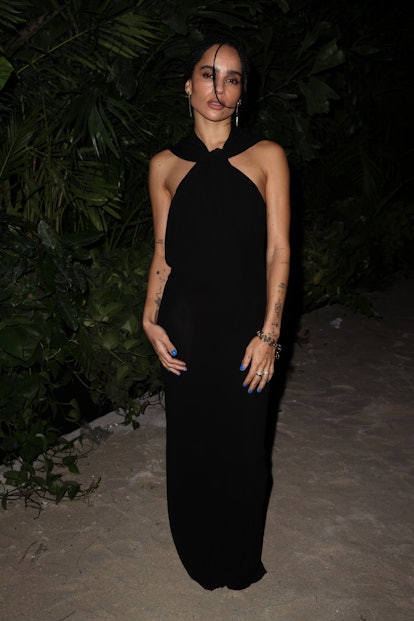 Zoe Kravitz wearing a black maxi dress from Saint Laurent at  the Miami Art Basel 2022.