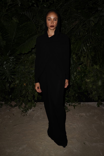 Adwoa Aboah wearing a black hooded dress from Saint Laurent at  the Miami Art Basel 2022.