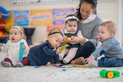 A group of babies in a daycare center, in an article about baby name trends for 2023.