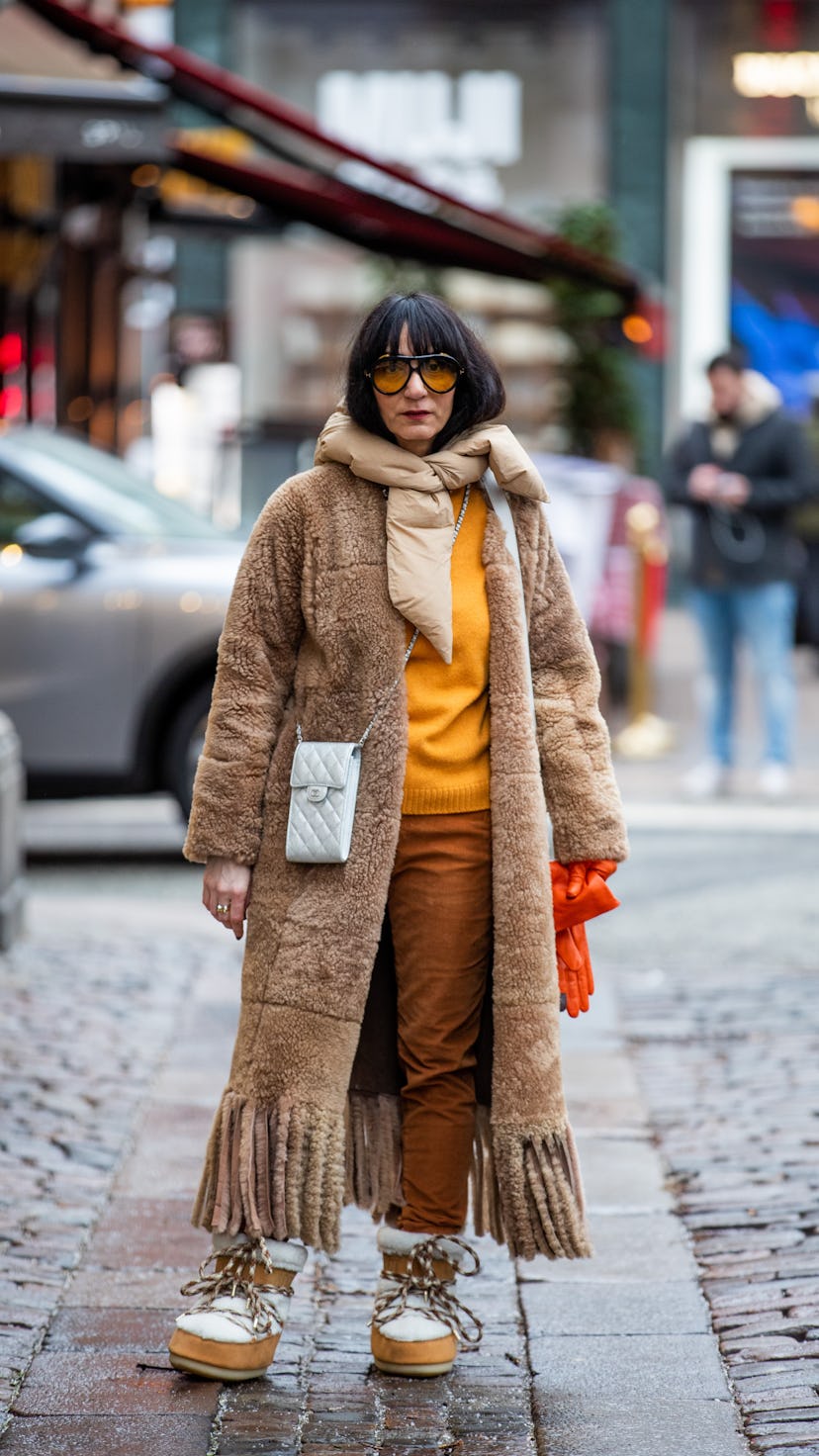 COPENHAGEN, DENMARK - FEBRUARY 01: Susan Stjernberger is seen wearing silver Chanel bag, moon boots,...