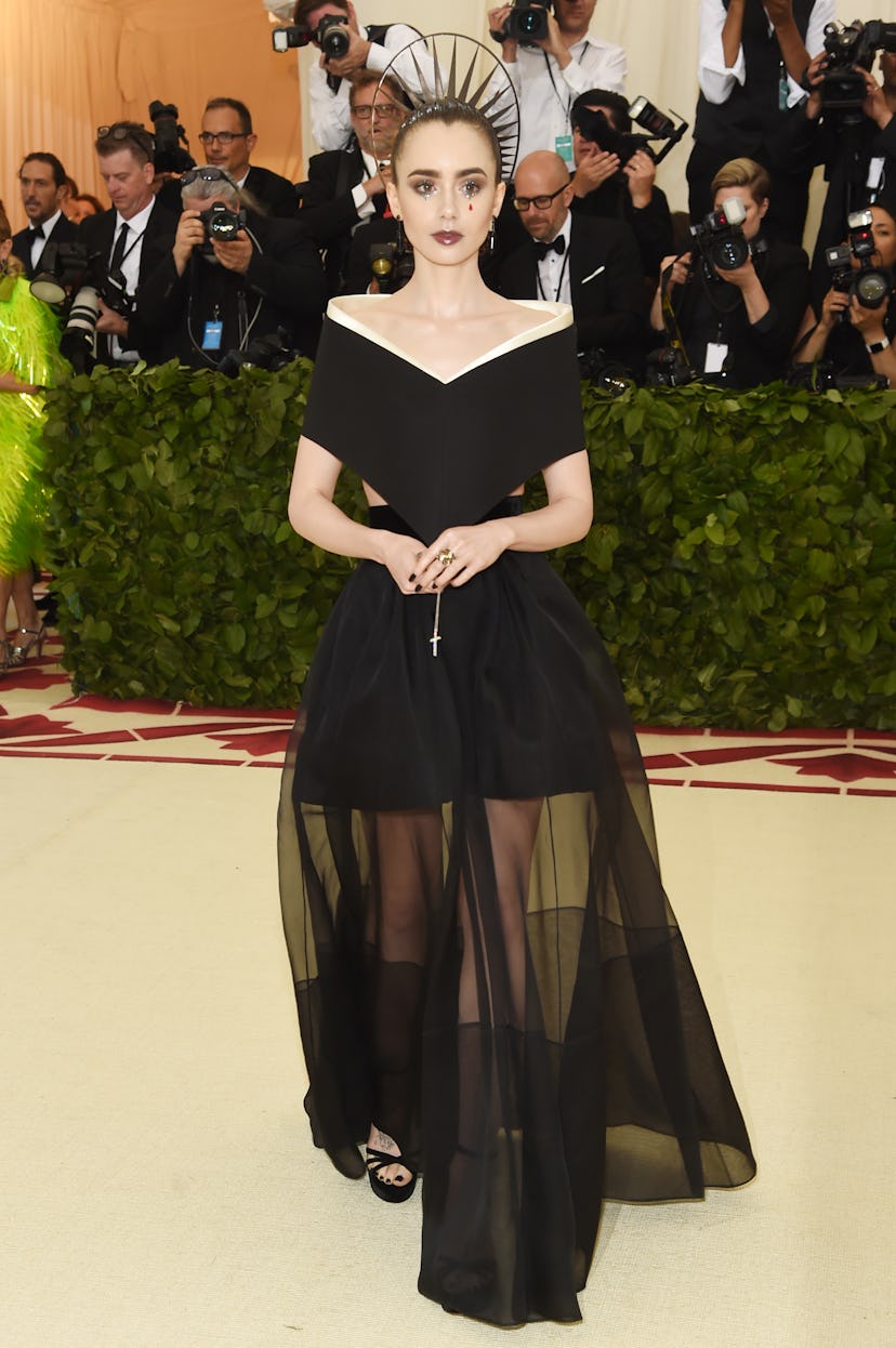 Lily Collins attends the Heavenly Bodies: Fashion & The Catholic Imagination Costume Institute Gala ...