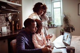 Close up of a young family consulting with their doctor in an article about children's tylenol short...