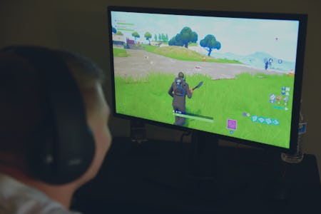Aidan Fry plays Fortnite in his room after school Monday. Photo by Lauren A. Little 4/30/2018 (Pho...