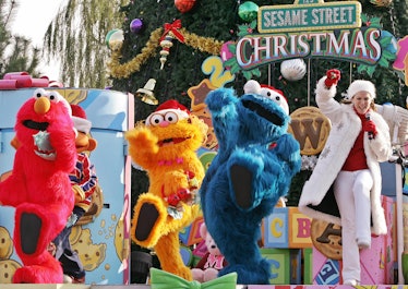 OSAKA, JAPAN:  Sesame Street characters (L-R) Elmo, Zoe and Cookie Monster dance on the stage for it...