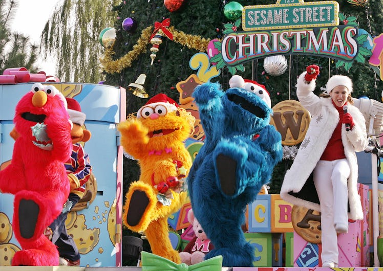 OSAKA, JAPAN: Sesame Street characters (L-R) Elmo, Zoe and Cookie Monster dance on the stage for it...