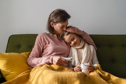 a mom and child snuggling in an article about the children's tylenol shortage 2022