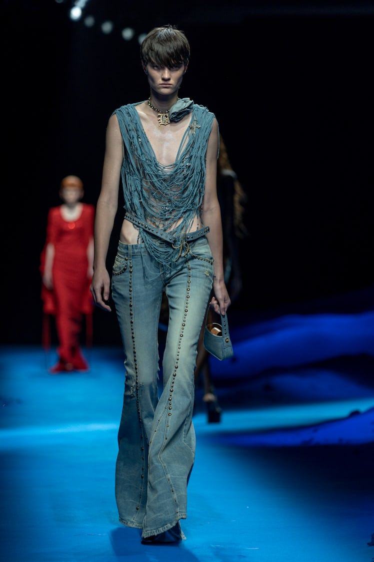 A model wearing denim at the fashion show at the Milan Fashion Week Women's Collection Spring Summer...