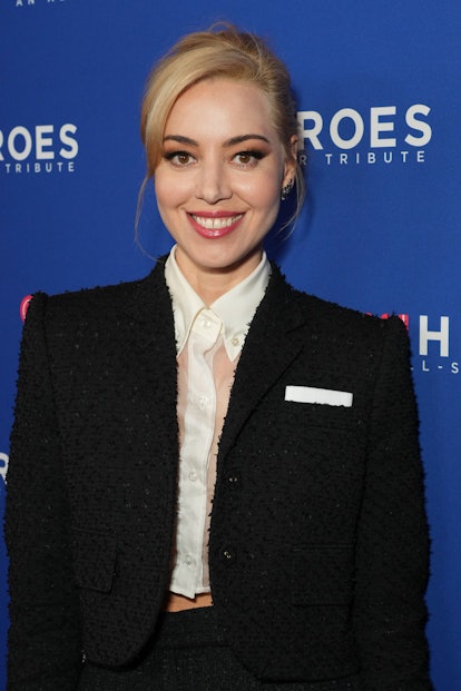 Aubrey Plaza attends the 16th annual CNN Heroes: An All-Star Tribute wearing a black suit and her bl...