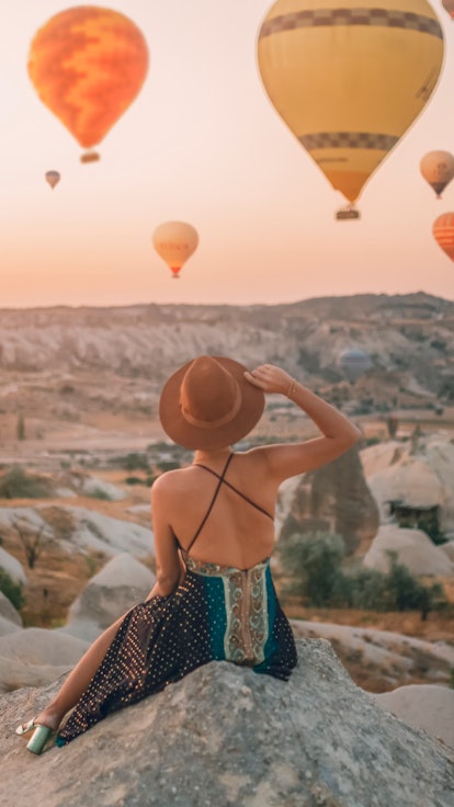 A woman in turkey finds the best solo travel destination for your zodiac sign.