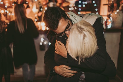 Couple sharing a kiss for a New Year's at midnight, in a story about New Year's trivia.