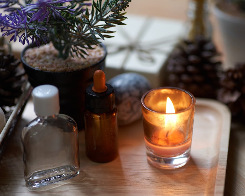 scented things, like a lit candle and dropper of oil, in an article about the most attractive smells