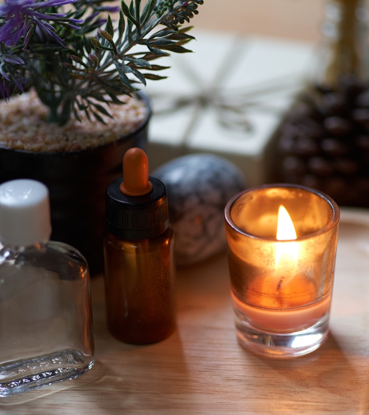 scented things, like a lit candle and dropper of oil, in an article about the most attractive smells