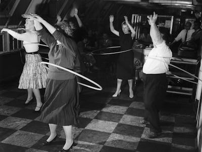 London office workers spent their lunch break learning to hula hoop as the new craze hits Britain. B...