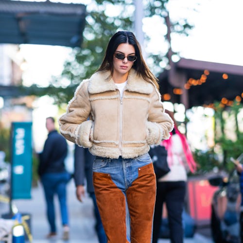 Kendall Jenner wearing brown square-toe boots.