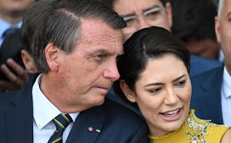 Brazilian first lady Michelle Bolsonaro (R) talks with and Brazilian President and re-election candi...