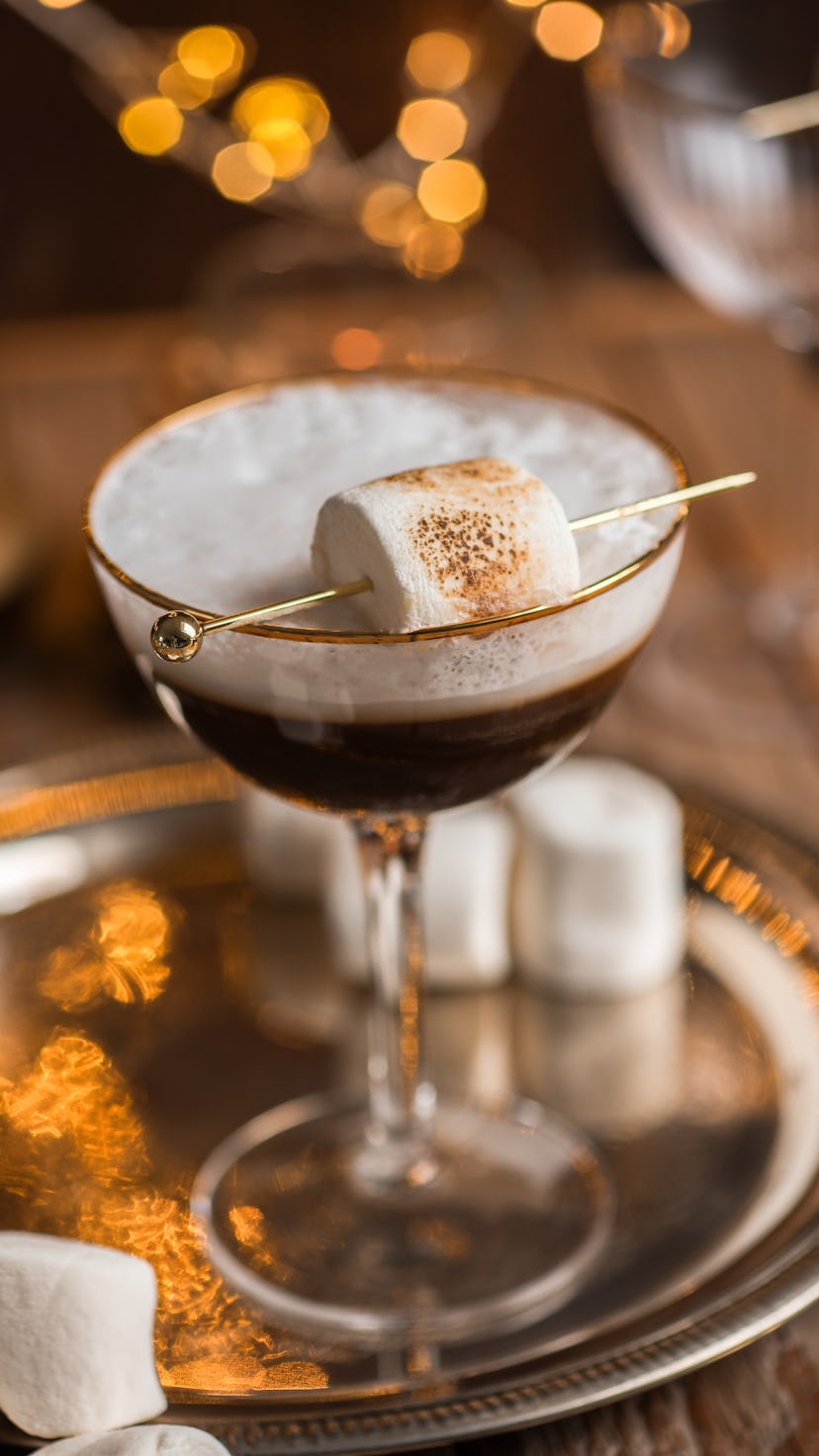White Russian cocktail drink with Espresso and marshmallow in festive Christmas holiday scene