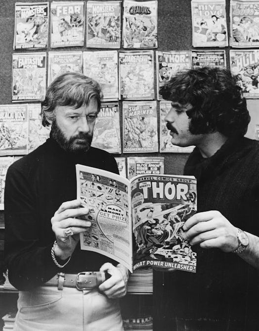 New York, N.Y.: Stan Lee reads a comic book with Steve Lemberg at their office on Madison Avenue in ...