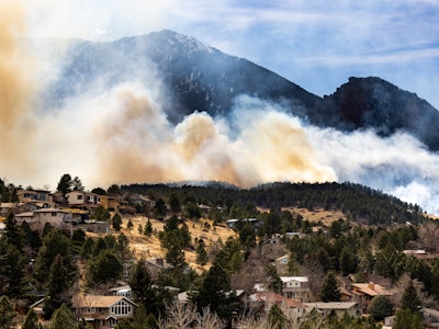 BOULDER, CO - MARCH 26: The NCAR Fire burns on March 26, 2022 in Boulder, Colorado. The wildfire, wh...