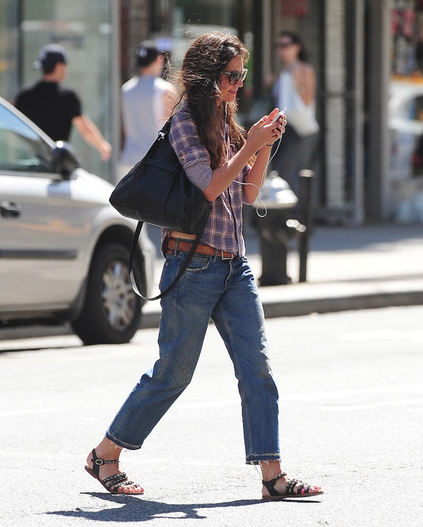 Katie Holmes carrying a black tote bag from Longchamp.