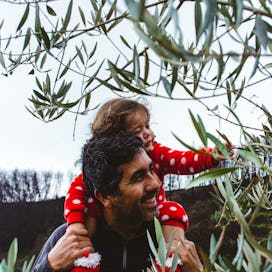 Father bonding with daughter in the garden in Guarda, Serra da Estrela, Portugal