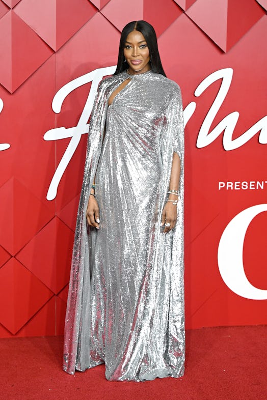Naomi Campbell wearing a silver Valentino dress.