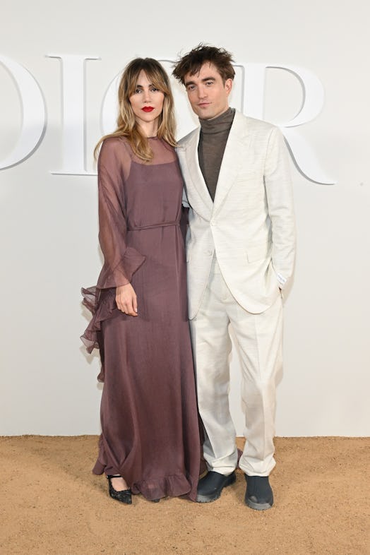 Suki Waterhouse and Robert Pattinson attend the Dior Fall 2023 Menswear Show 