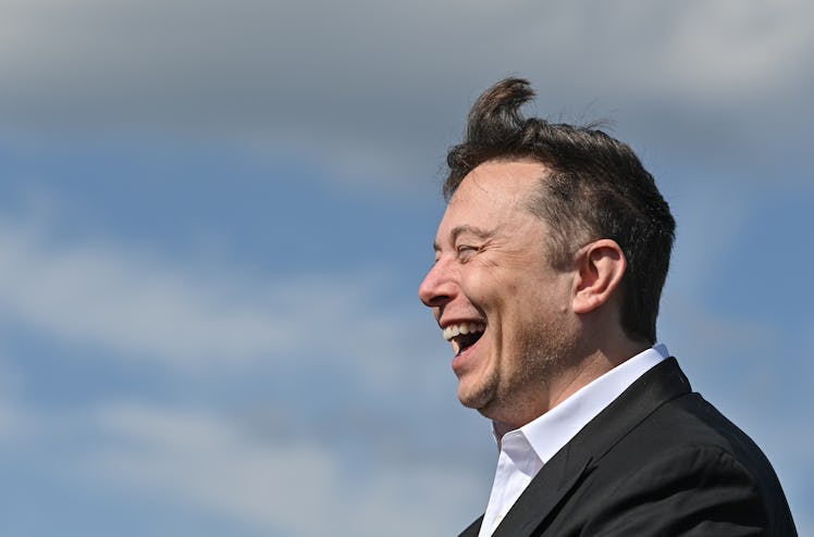 03 September 2020, Brandenburg, Grünheide: Elon Musk, Tesla boss, stands laughing on the Tesla Gigaf...