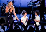 Mariah Carey performs onstage with Monroe Cannon and Moroccan Cannon.